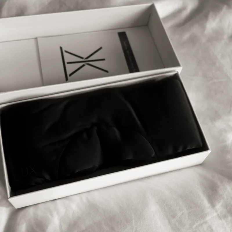 The open gift box with the mask and printed insert