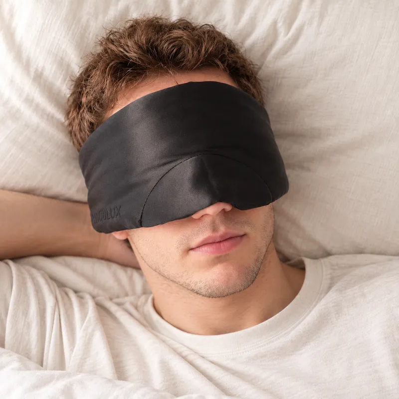 The black silk mask worn while resting on a pillow